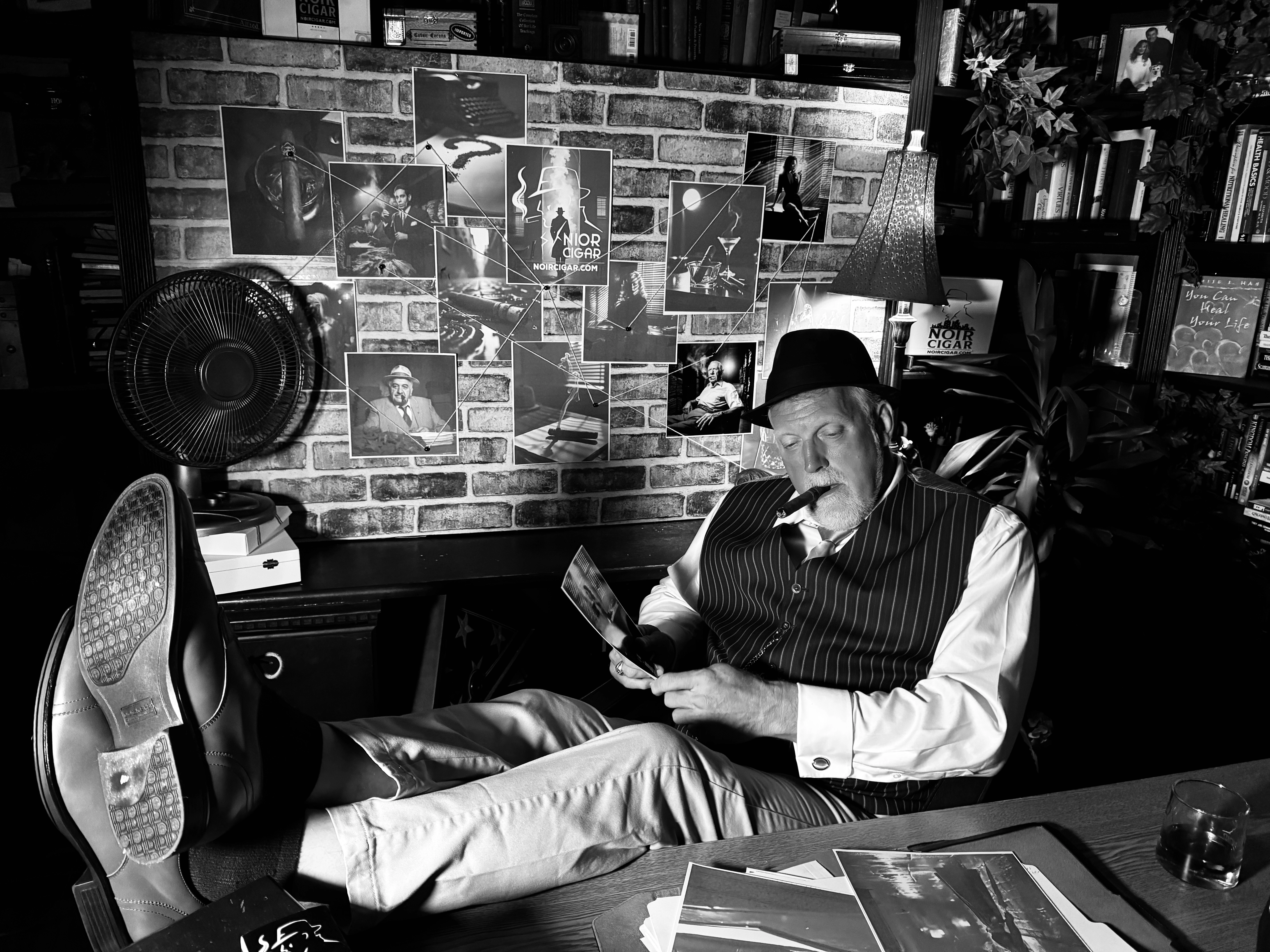 Detective Watson — Scott Watson feet up at desk with cigar and case files
