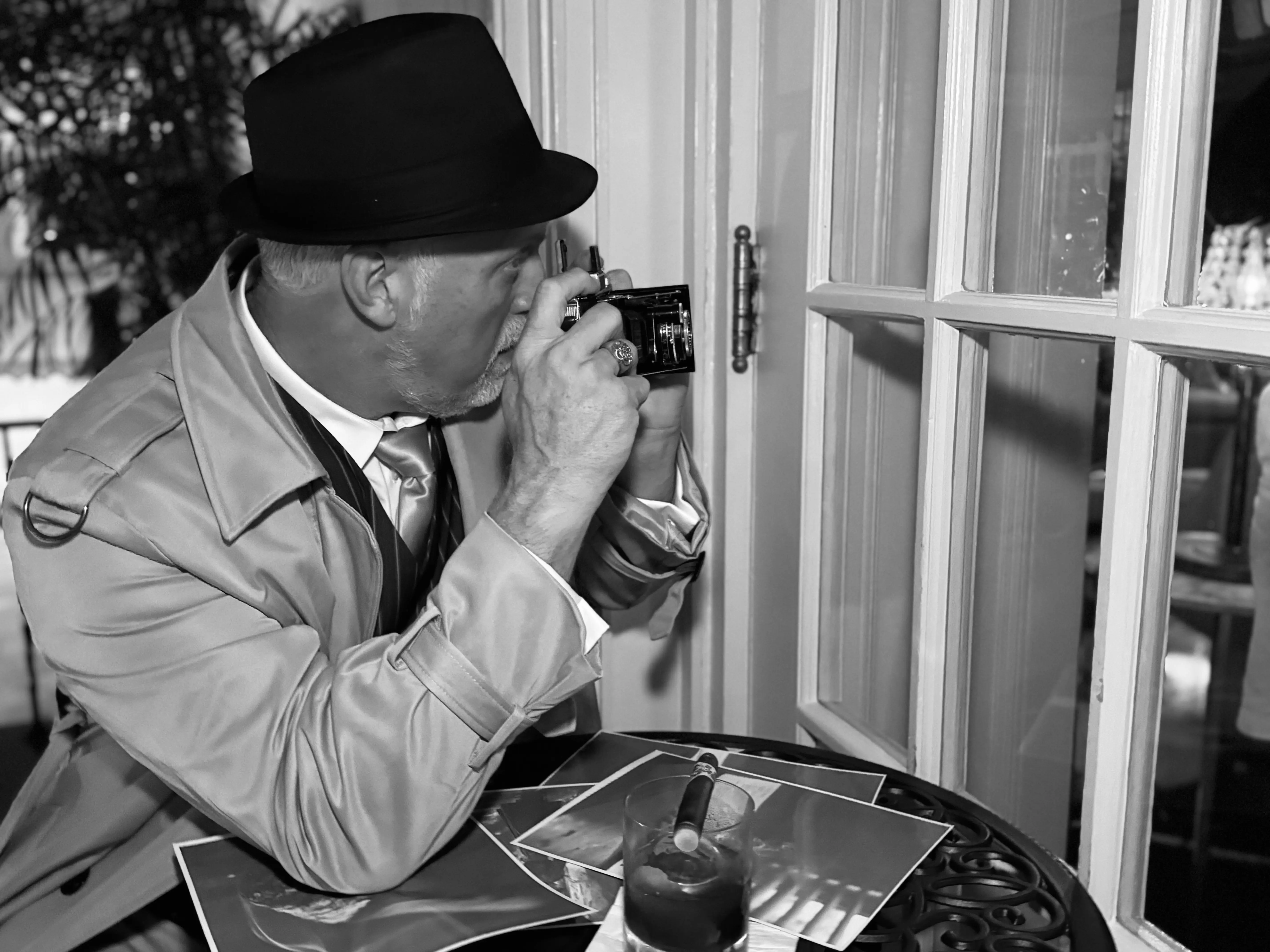 Scott Watson on stakeout — Detective Watson noir cigar camera surveillance